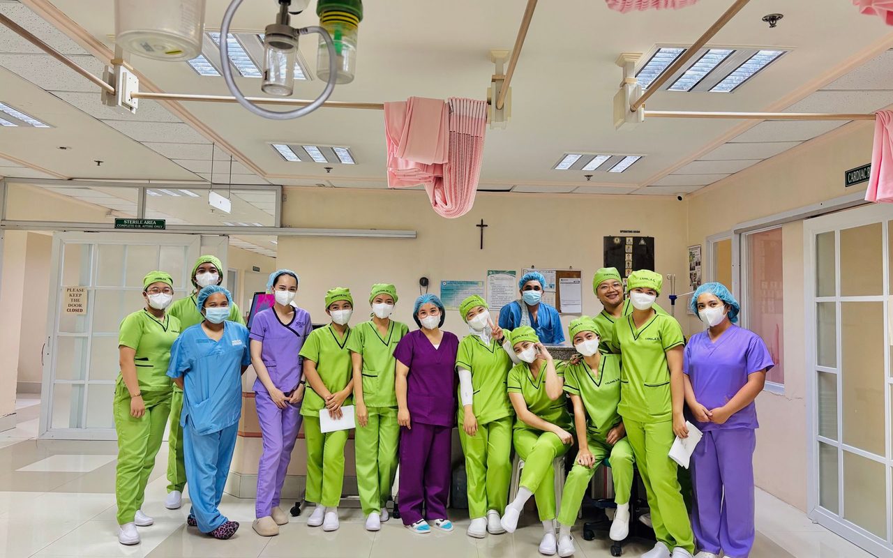 A team of nurses in scrubs on a hospital ward in Baguio City, Philippines