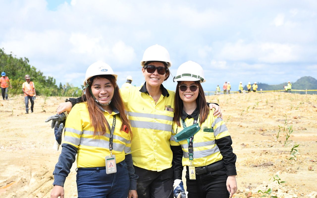 Three site staff in hard hats and safety vests on a site in Cebu City, Philippines