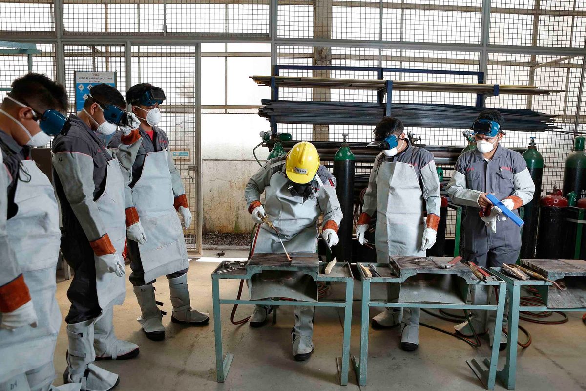 Welders in protective gear at a training workshop in the Philippines